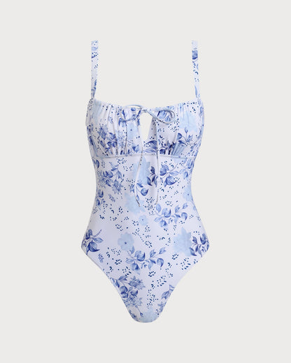 Traje de baño de una pieza con fruncidos florales blancos