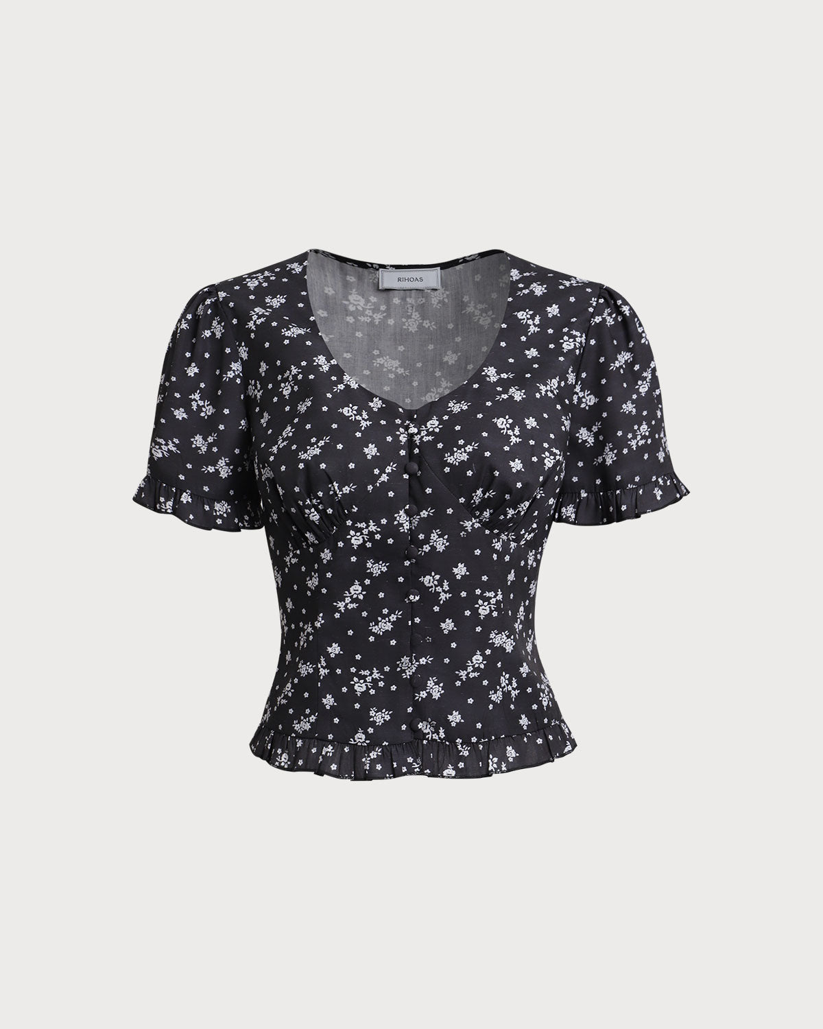 Blusa Negra con Estampado Floral de Cuello Redondo