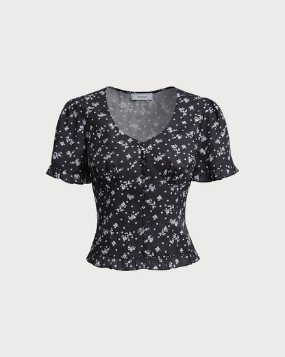 Blusa Negra con Estampado Floral de Cuello Redondo